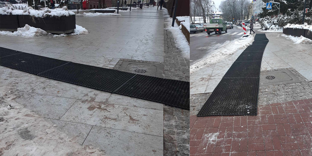 Położono gumowe maty przed wejściem na deptak. Radny komentuje: „Mamy wprawę w przenoszeniu wycieraczek…”